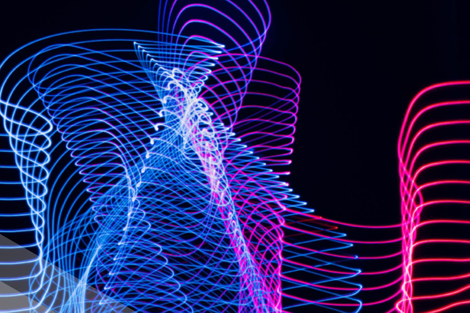 blue purple and pink springs or waves on a black background