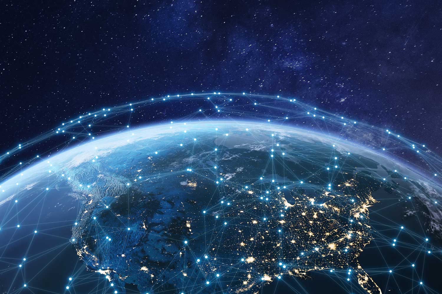 A view of earth from space with a starry sky behind. The United States is lit up in various locations. Over the earth are light spots connected by lines, illustrating interconnection.