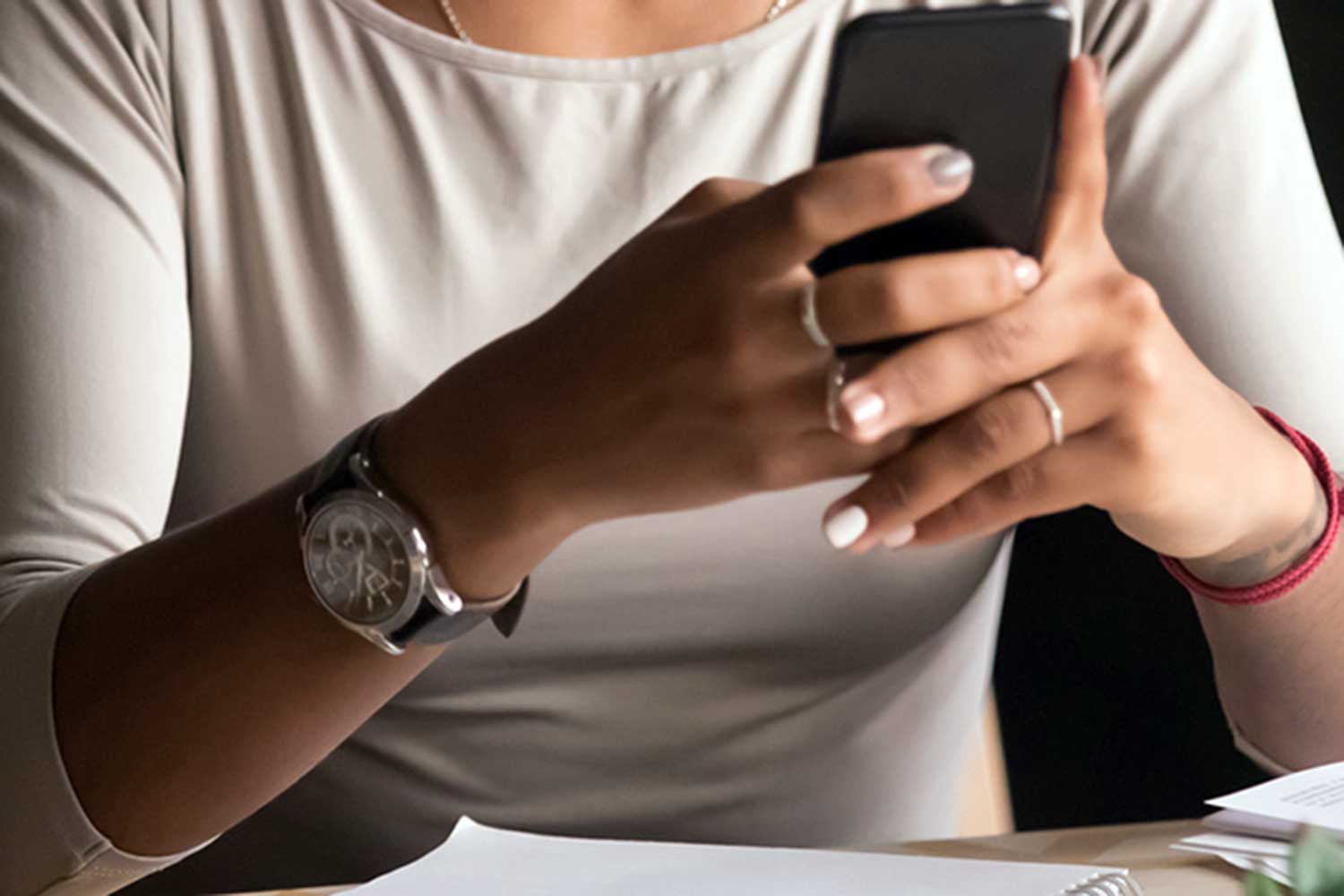 An image of a person using their phone.