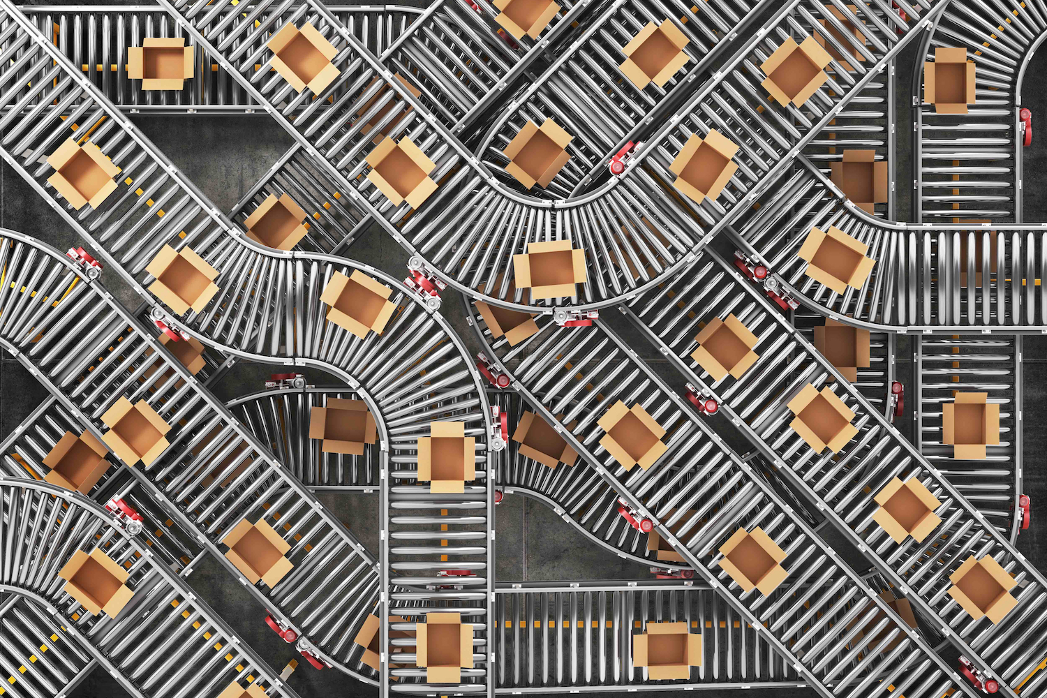 An image of cardboard boxes traveling along a series of conveyor belts. It represents a link between labor and artificial intelligence.