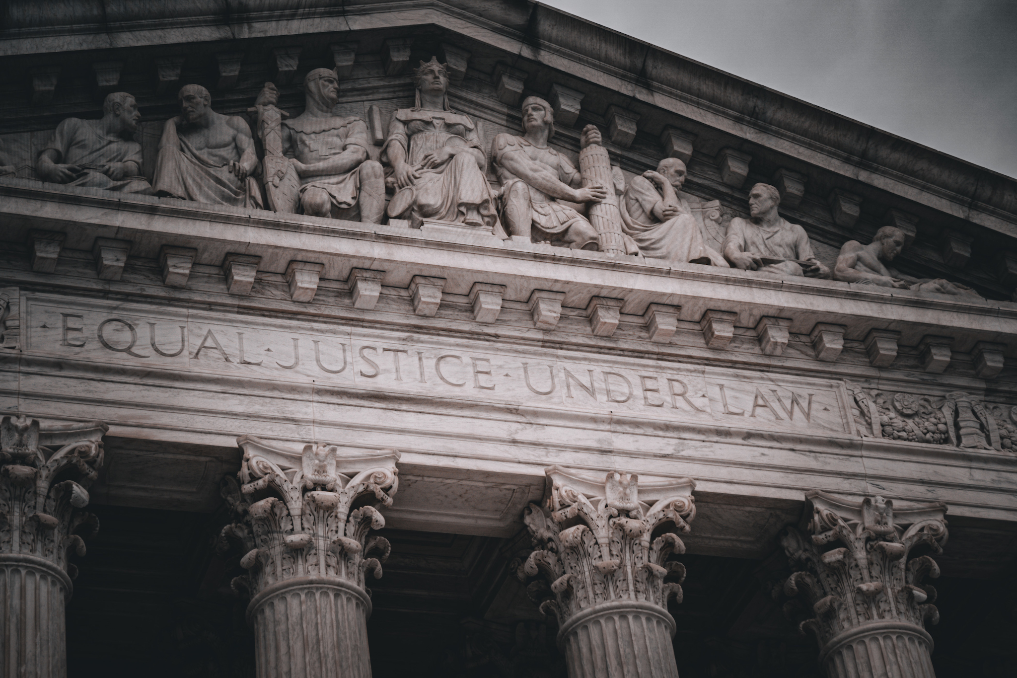 A closeup photo of the US Supreme Court building, which reads, "Equal justice under law."