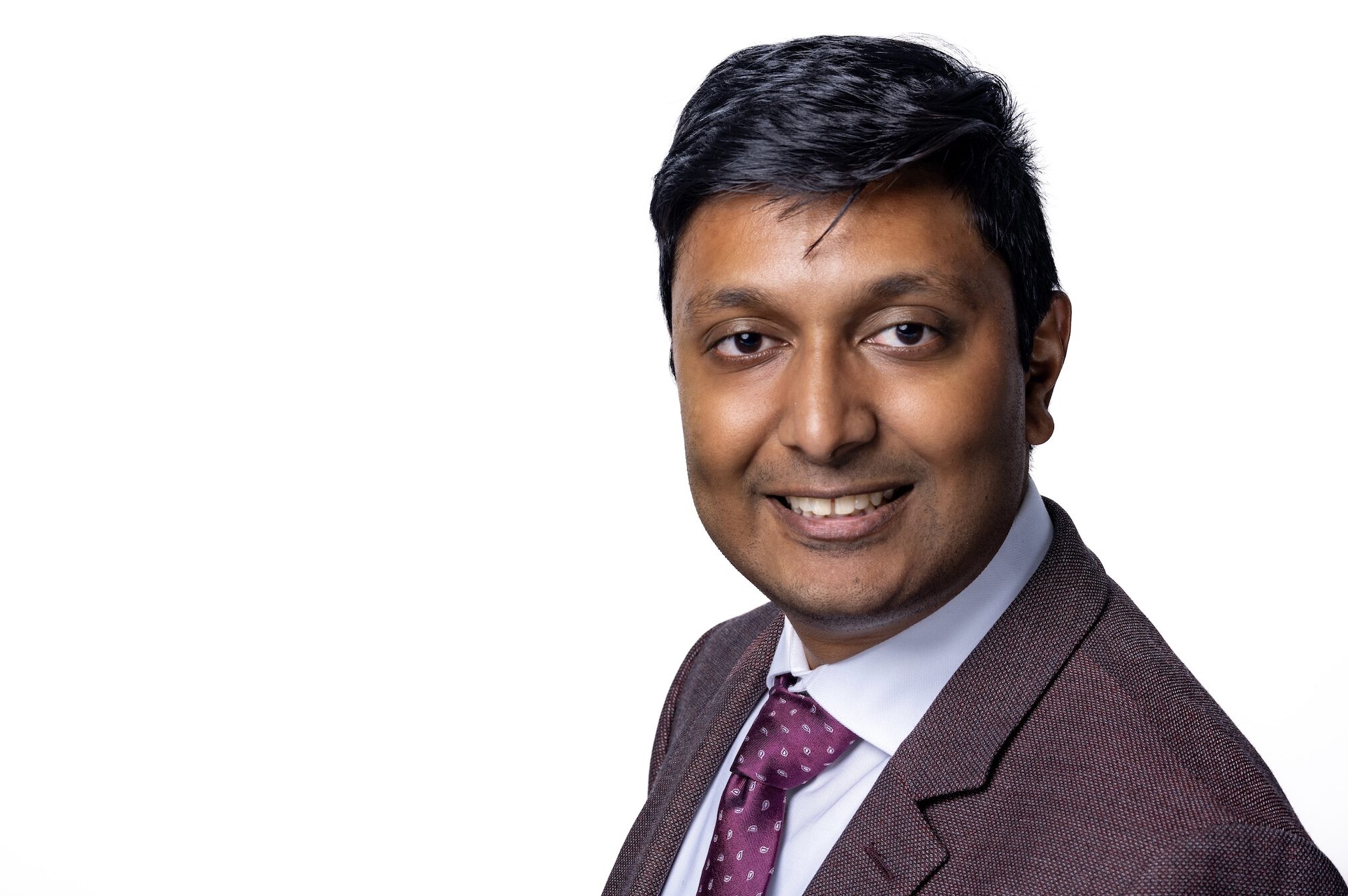 Yameen Huq's headshot.