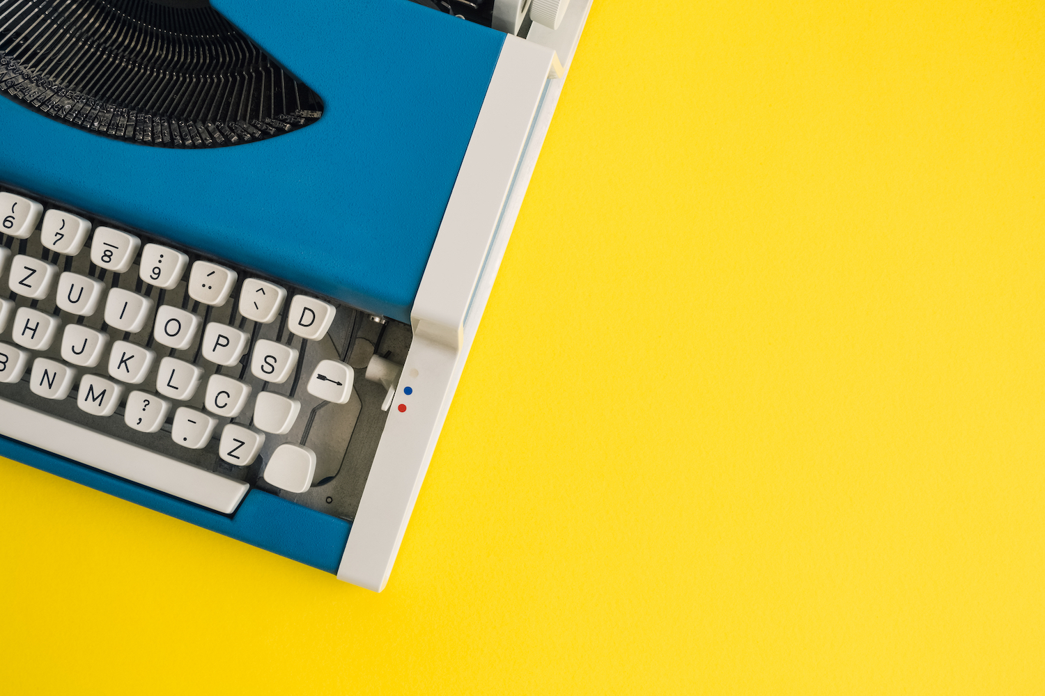 A close-up photograph of a retro typewriter to contrast this call for best reporting on AI.