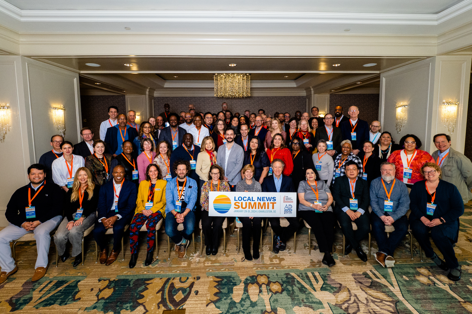 A group photo of attendees at the Local News Summit.