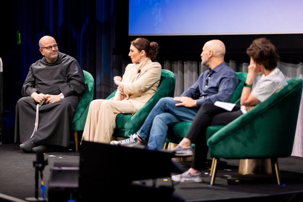 Panelists on stage at Shared Futures.