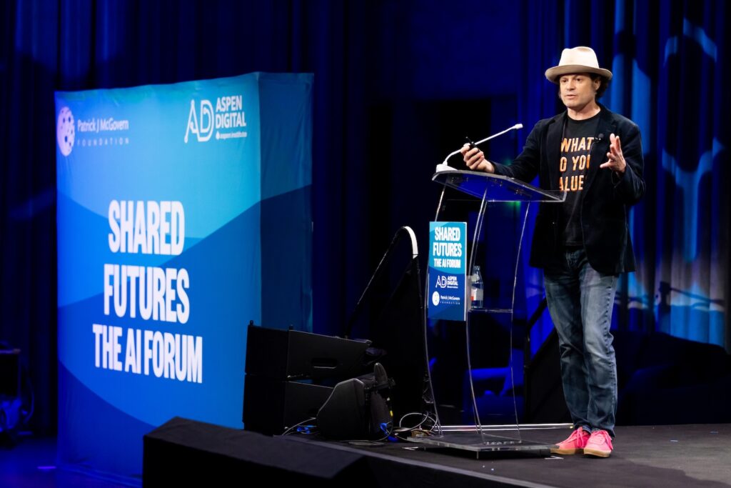 Aaron Huey on stage at Shared Futures.