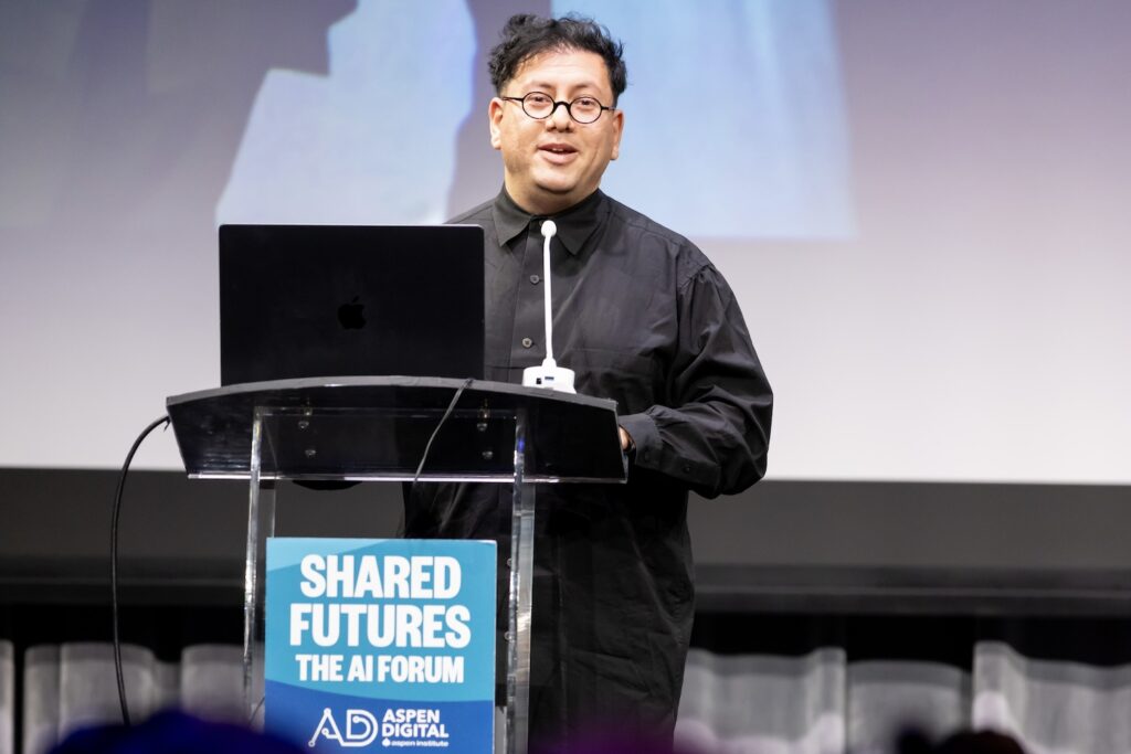 Refik Anadol on stage at Shared Futures.
