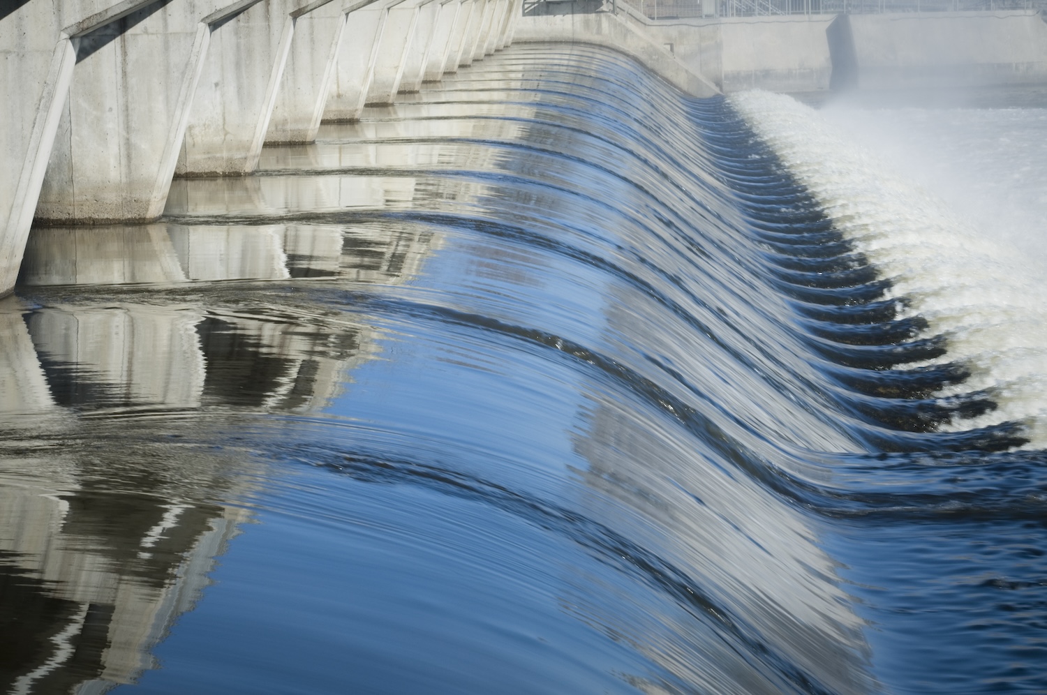 A close up image of a water flowing, representing water utilities' need for cybersecurity.