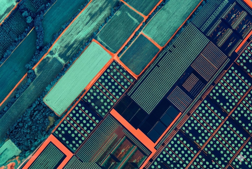 Digital collage of fields and computer chips altered by Reboot Democracy blog using Gemini