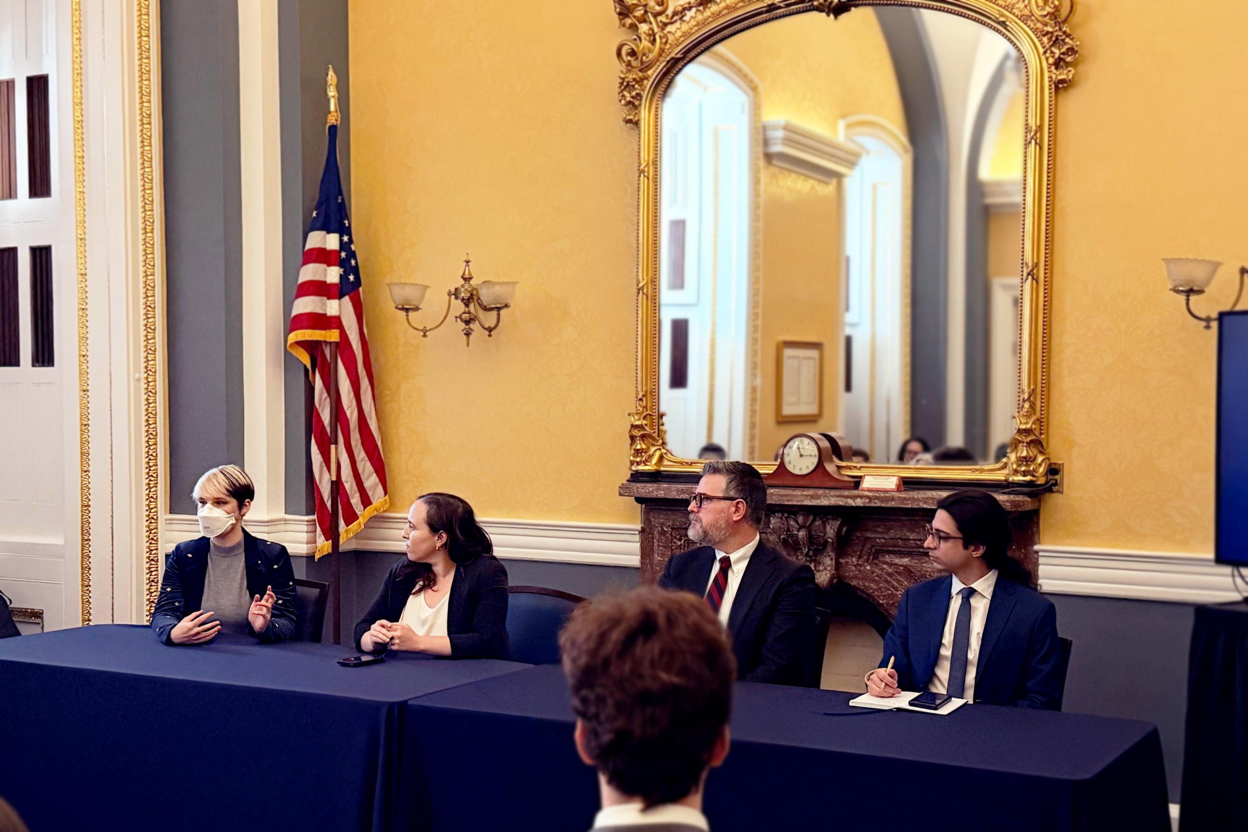 B, Miranda, Mark, and Nick on a panel in Congress