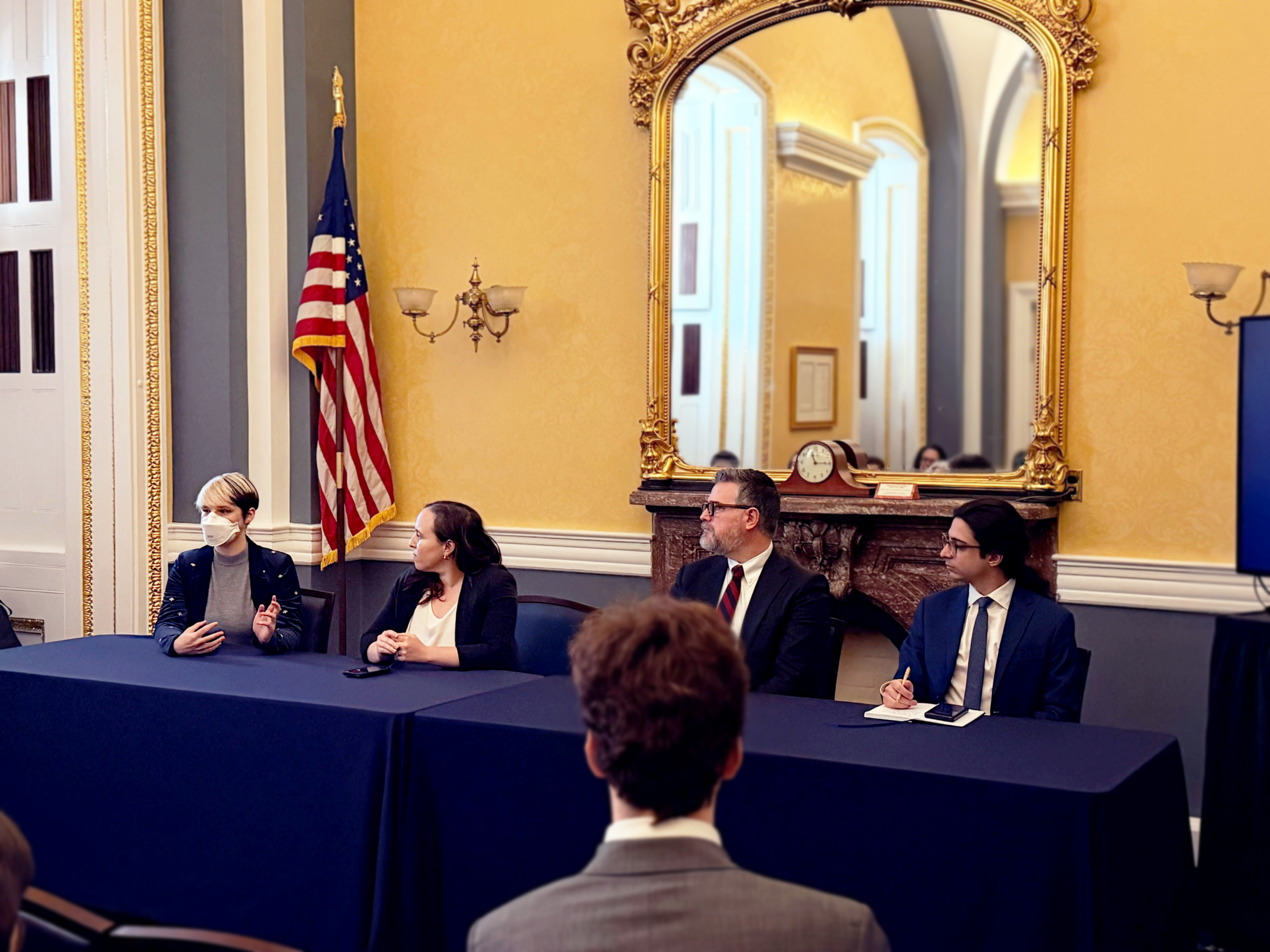 B, Miranda, Mark, and Nick on a panel in Congress